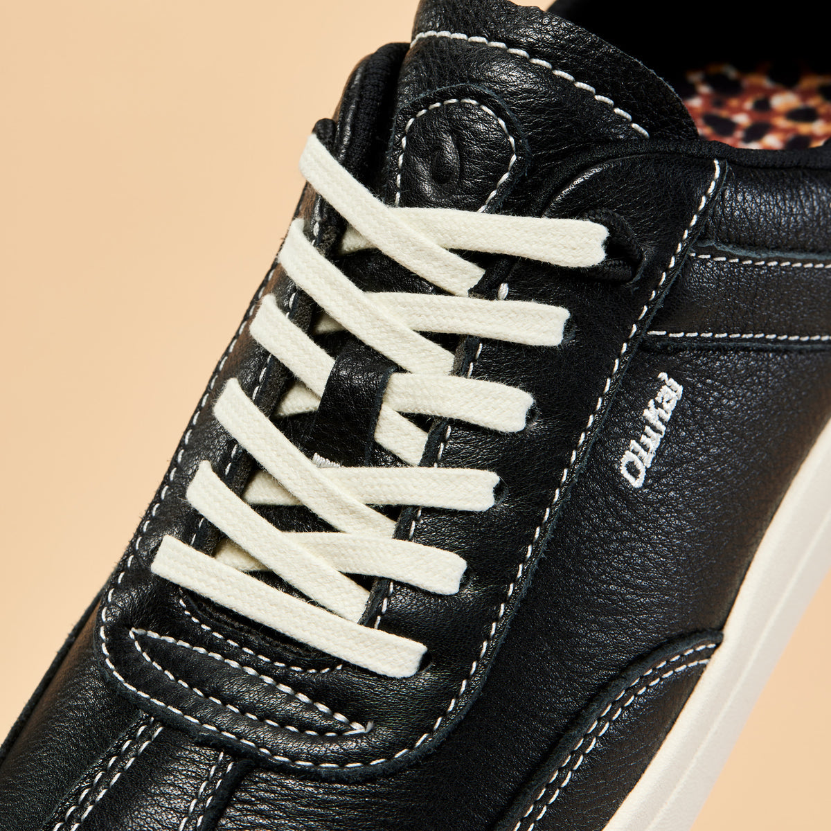 OluKai Hā‘upu Women’s Leather Sneakers - Onyx